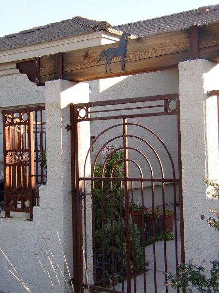 Courtyard gate and fencing.