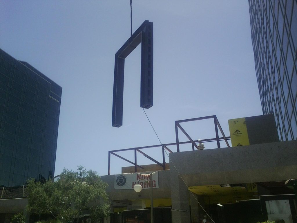 This is one of them effortlessly flying into place at the new Del Friscos restaurant that is being built in place of the old Houstons on Camelback Rd